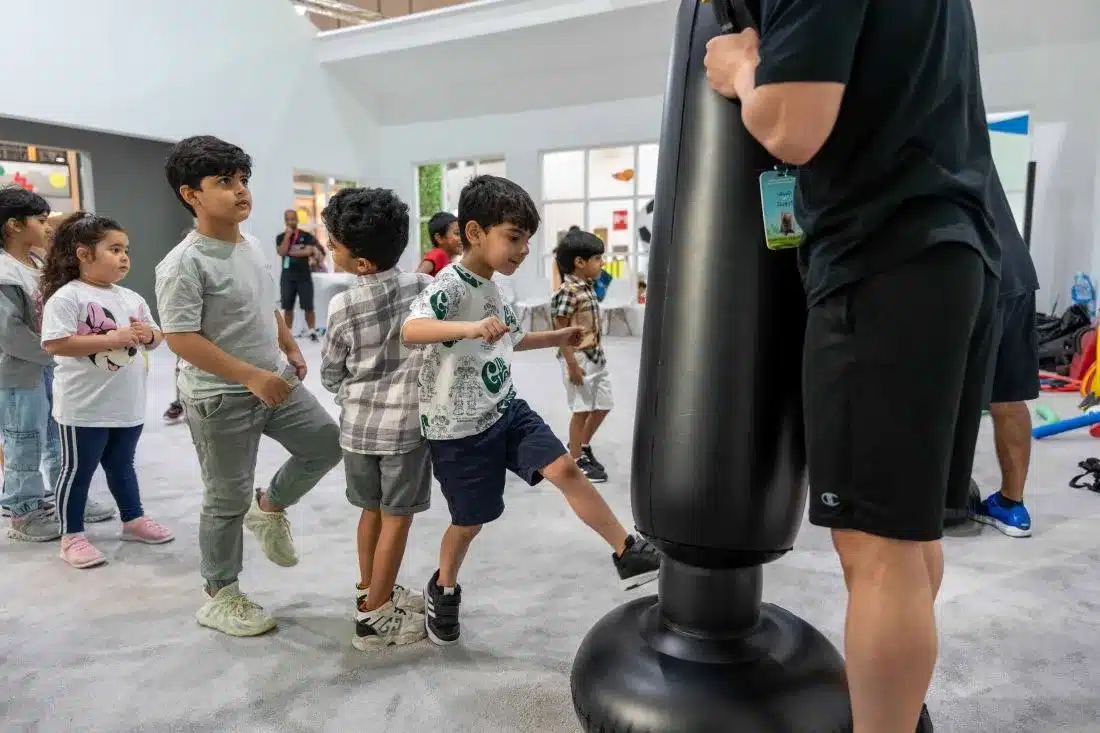 Kids practicing kickboxing workshop at Sharjah Children Reading Festival