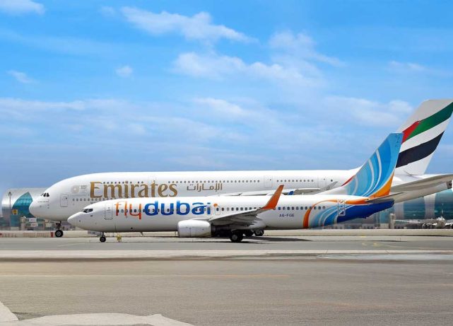 Emirates and flydubai aircraft at Dubai International Airport amid ongoing UAE-Saudi flight cancellations and regional travel disruptions