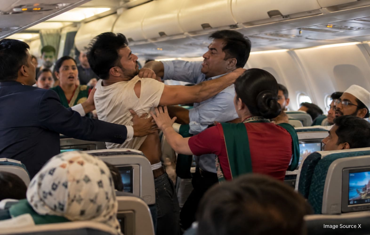 Passengers and cabin crew intervene during a viral mid-air confrontation aboard a Biman Bangladesh Airlines flight.