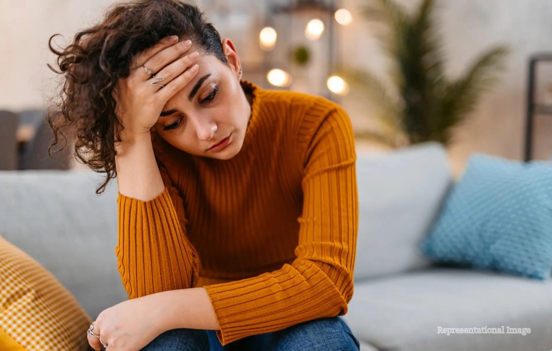 Person experiencing chronic stress as research links prolonged stress with increased cardiovascular and heart disease risk.