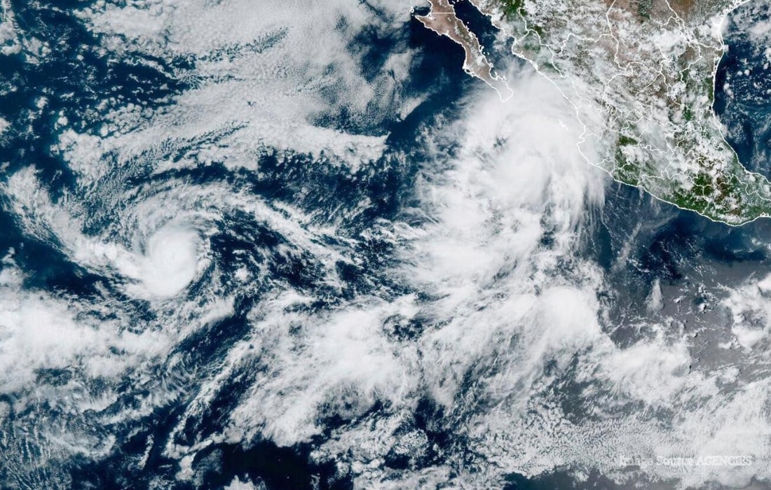 Satellite view of a tropical cyclone near Mexico as authorities warn of heavy rain, flooding and dangerous coastal conditions.