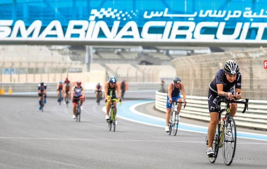 Cyclists and runners enjoy a free TrainYAS fitness session at the Formula 1 Yas Marina Circuit on Yas Island, Abu Dhabi.