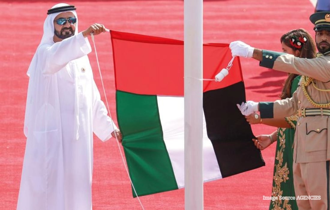 Sheikh Mohammed bin Rashid raises the UAE national flag during Flag Day celebrations in Dubai