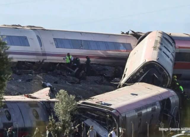 Rescue workers attend the scene of a deadly high-speed train collision near Madrid, Spain, involving Renfe and Iryo trains