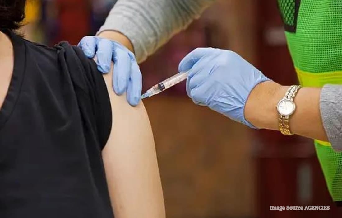 Healthcare professional administering a flu vaccine as UAE families prepare for the 2026 winter influenza season