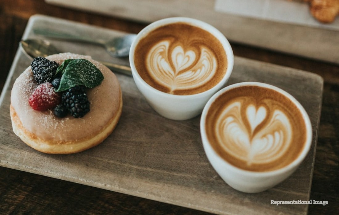 Barista preparing speciality coffee in a Dubai café during International Coffee Day celebrations.